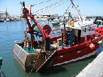 Een vissersboot in de haven van Grandcamp-Maisy